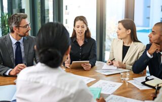 Leadership team discussing fp&a recruitment and talent acquisition strategies for a growing financial planning and analysis department.